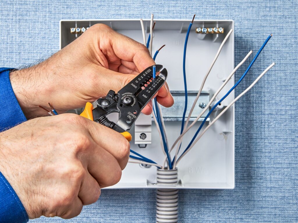 Electrician working on panel replacement