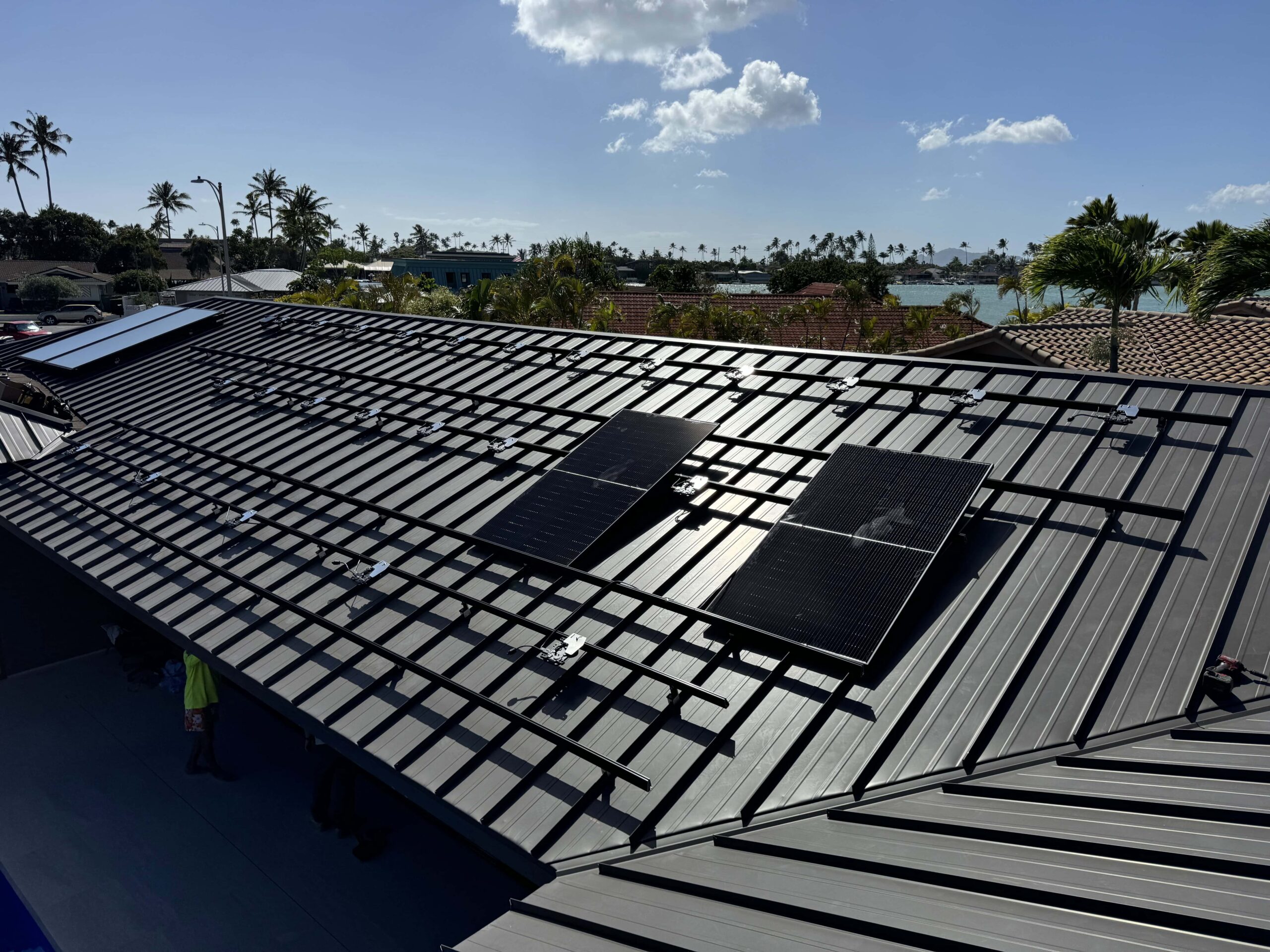 Solar racking installed on a standing-seam metal roof on Oʻahu